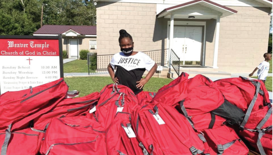 Local Student Provides Book Bags